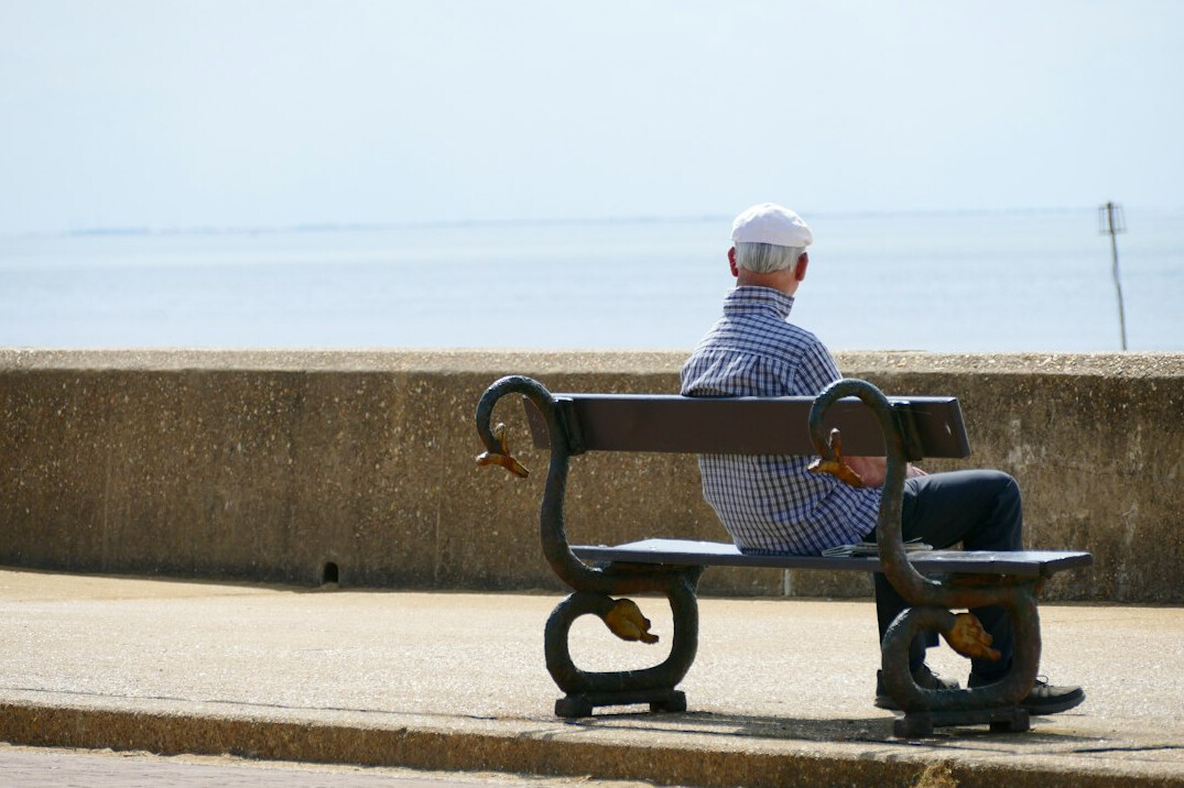 elderly man by sea
